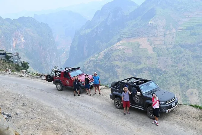 A driver-guided car stopping at a popular tourist attraction in Ha Giang