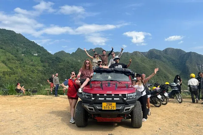Travelers discussing route details with Ha Giang car rental with driver service provider